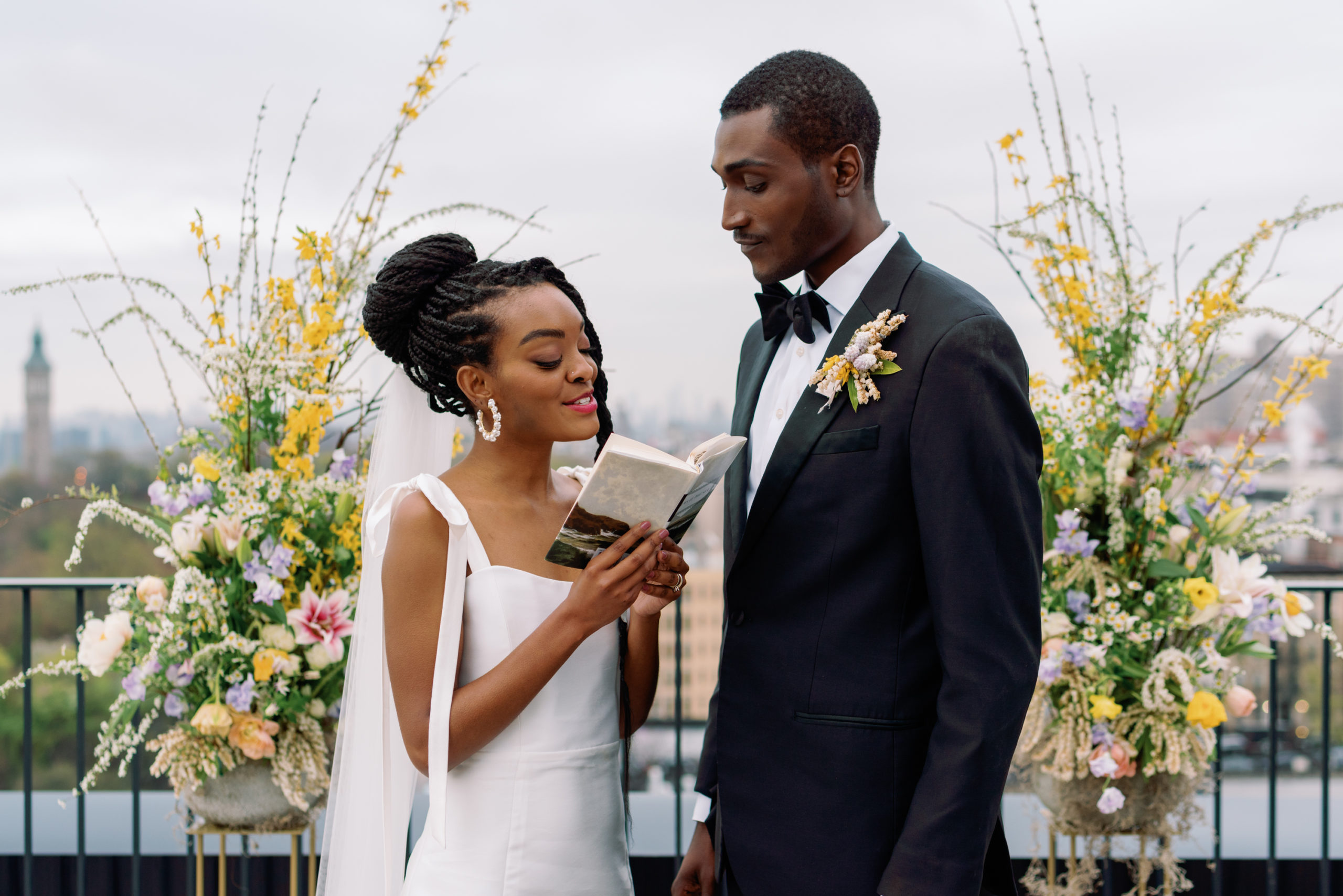 bride and groom reading ceremony love poems in at above the heights nyc wedding venue