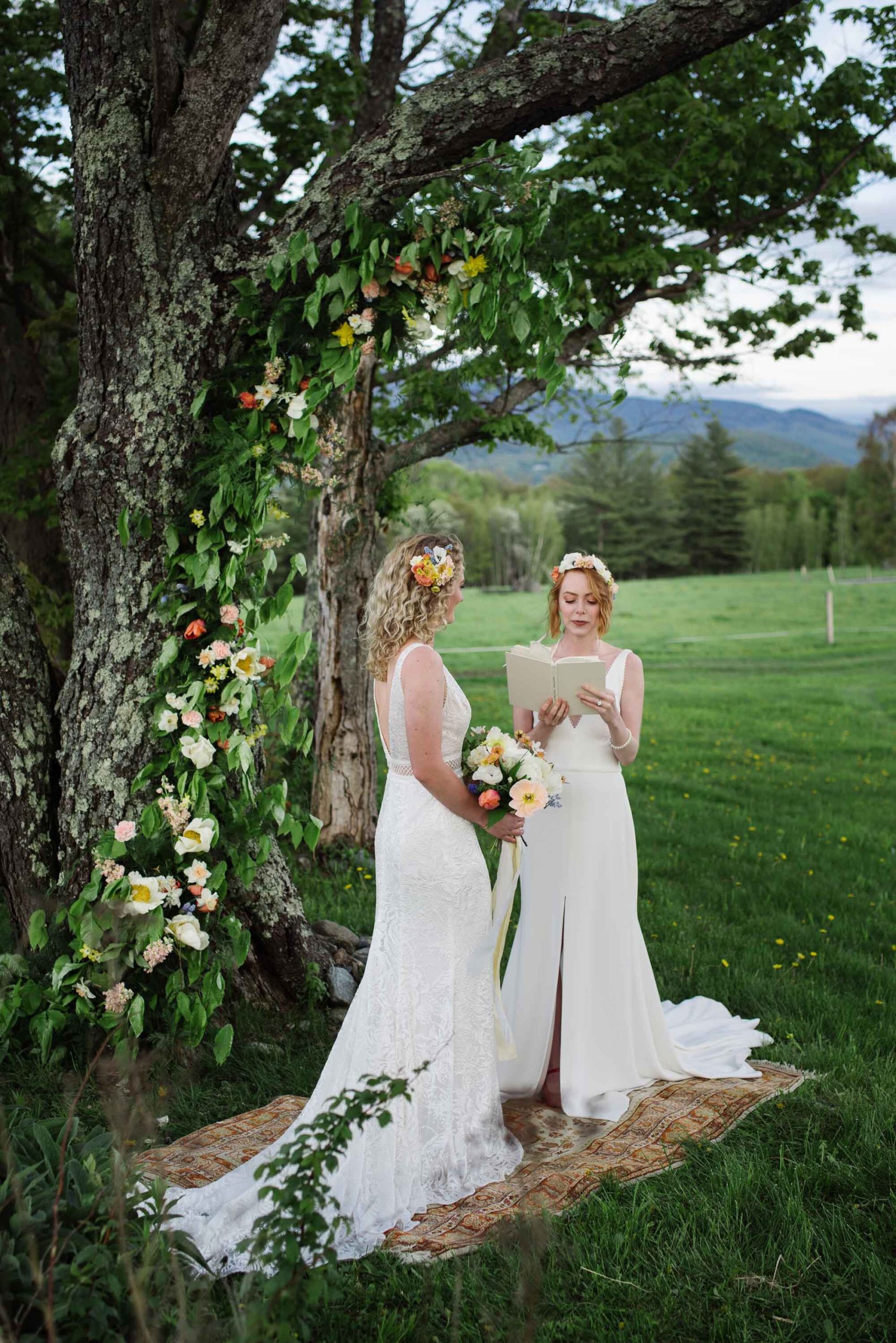 Couple reading a love poem at their elopement ceremony in Vermont