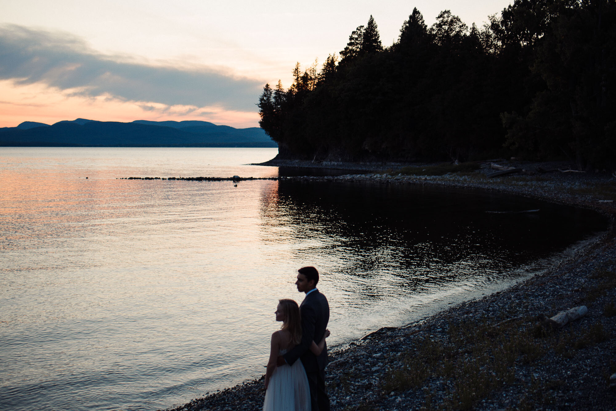 Bride and groom portraits by the lake at Elopement at Shelburne Farms