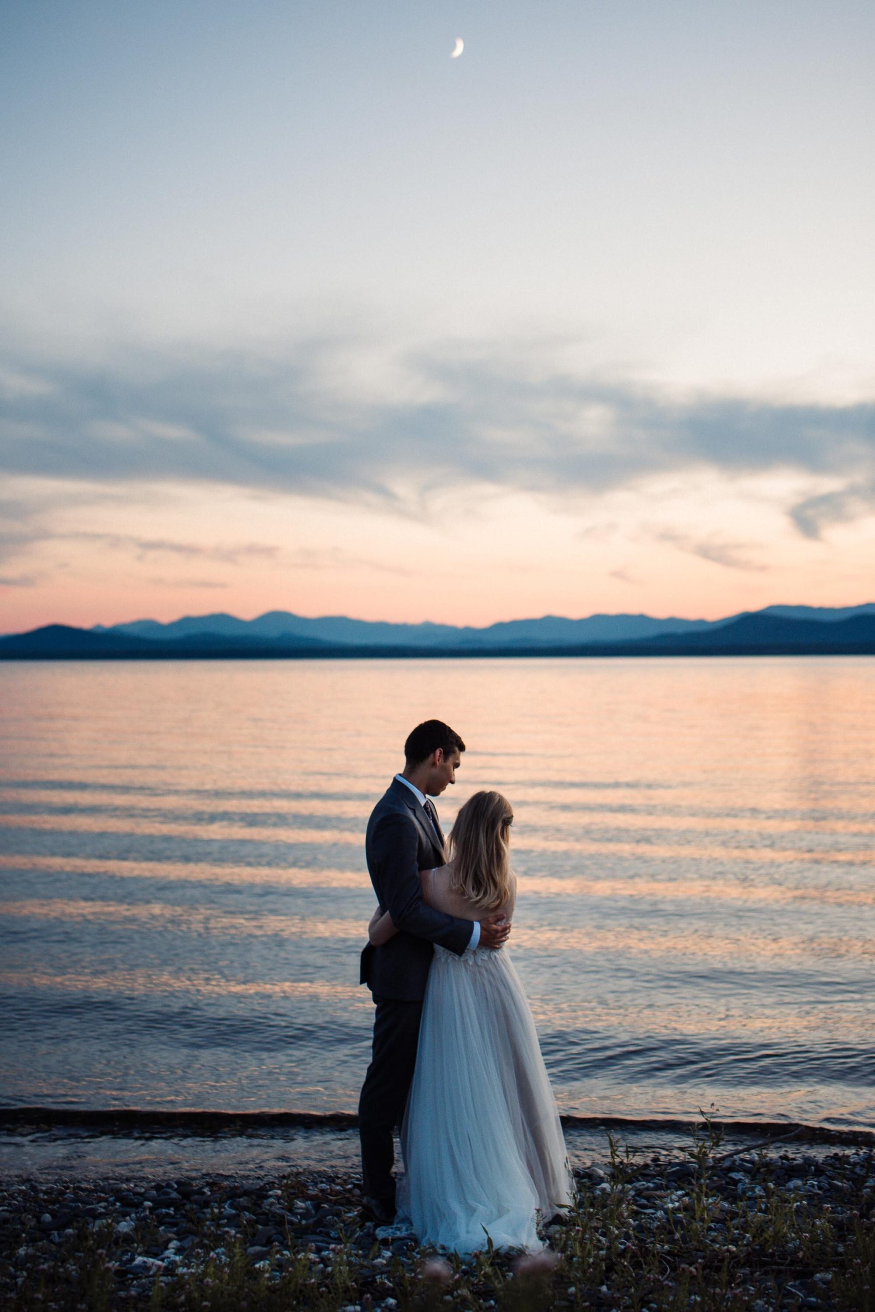 Bride and groom portraits by the lake at Elopement at Shelburne Farms