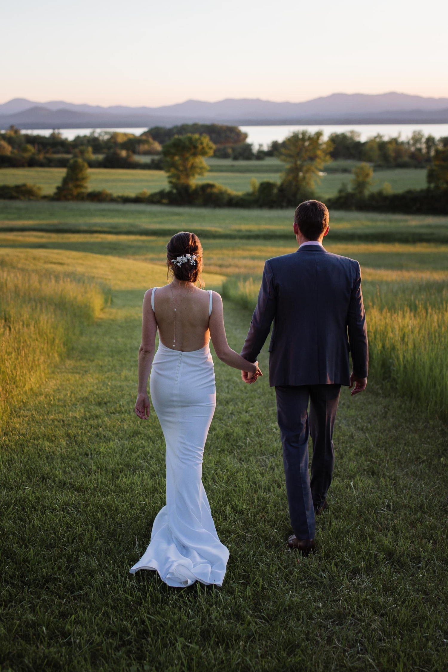 elegant Summer wedding in new england town of Shelburne, Vermont with views of mountains at sunset