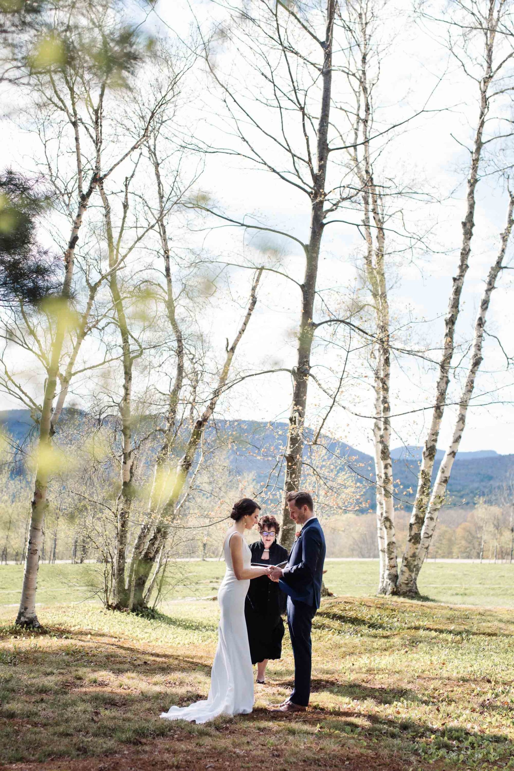Couple embraces in Birch Grove at Trapp Family Lodge Stowe VT