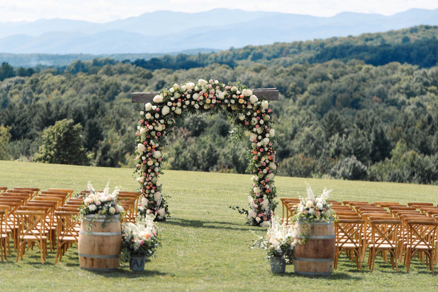 Arbor adorned by Clayton Floral, hydrangea, chrysanthemum, roses, lilies, at Maquam barn and Winery
