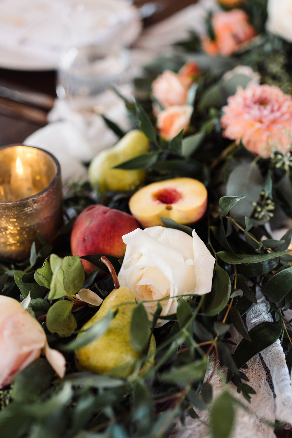 Summer inspired table garland with roses, peaches and pears