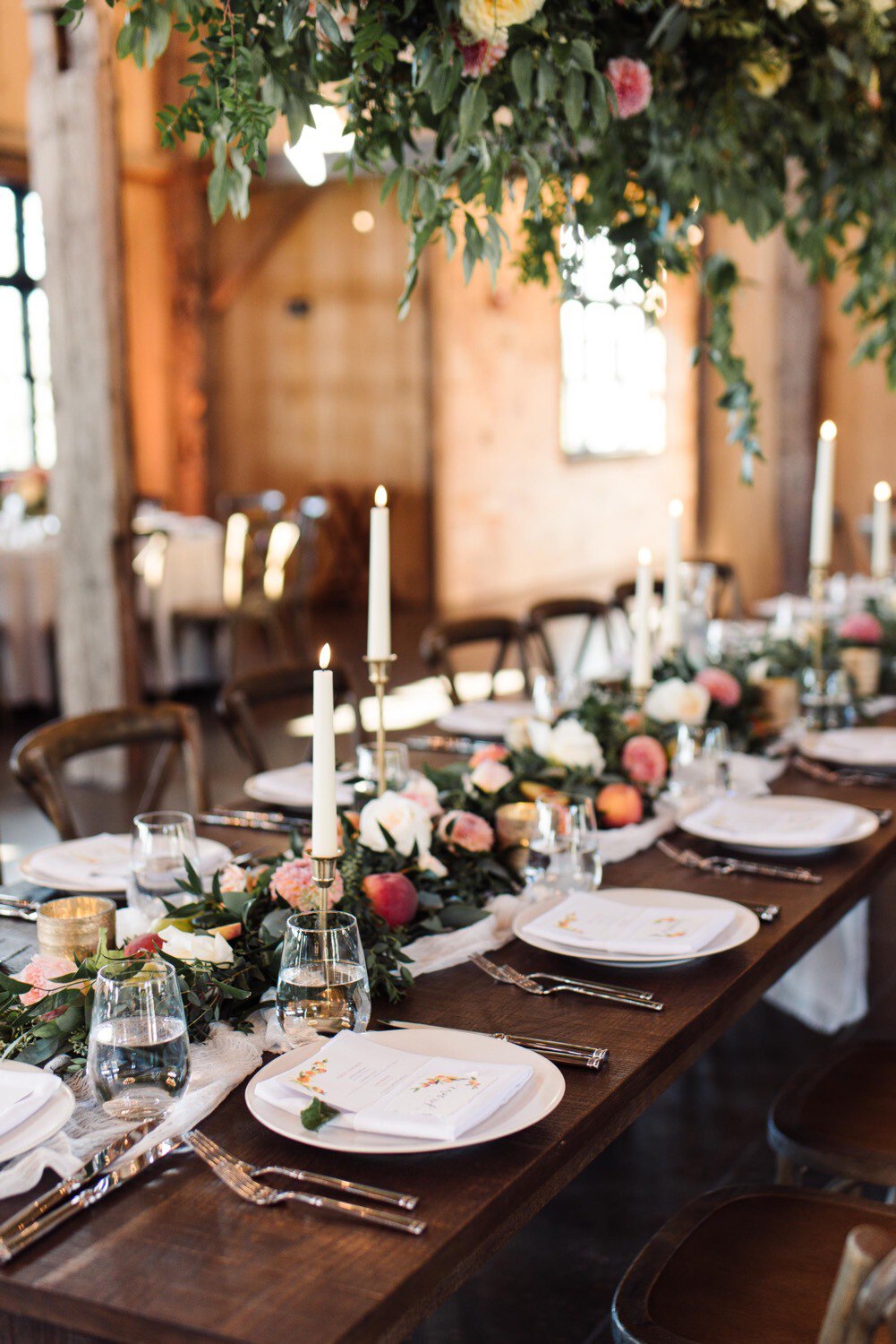 Table garland and place settings, summer wedding at Maquam Barn
