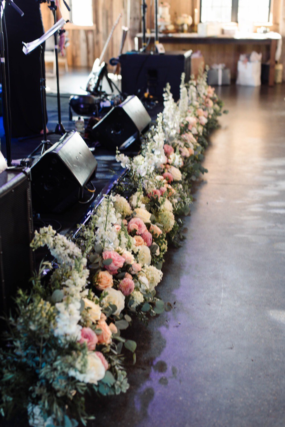 Flowers and sound equipment for live wedding band by clayton floral