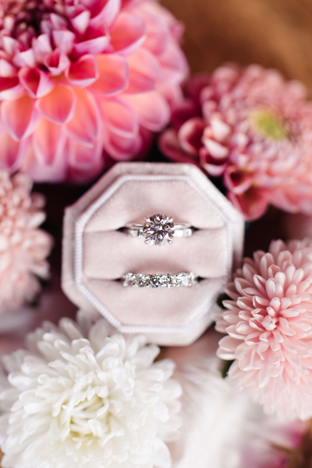 Close up of wedding rings and chrysanthemums