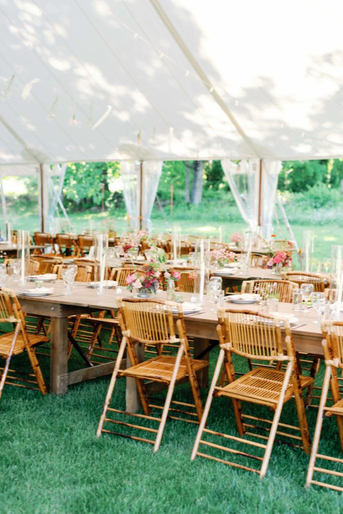 chic summery vt tented wedding reception with bamboo chairs chosen by harlow and dahlia event