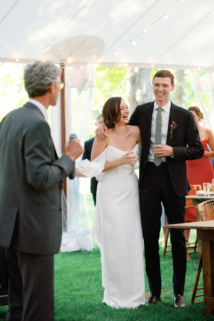 wedding toasts at tented reception for sailcloth tents
