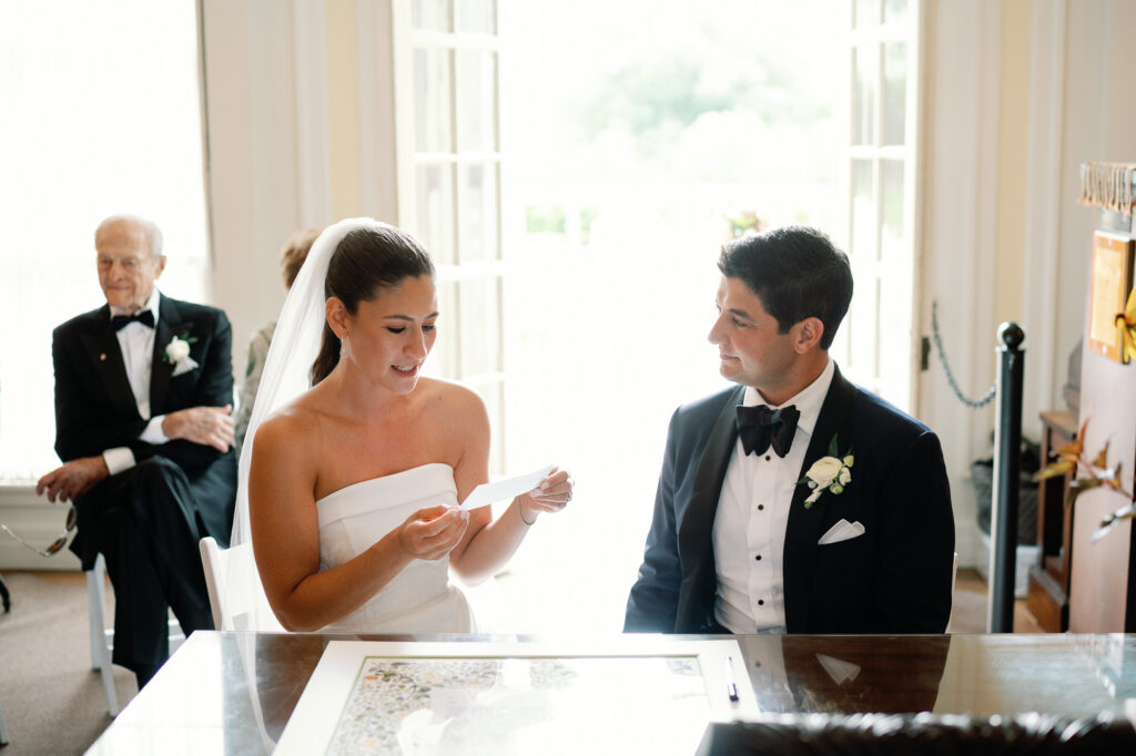 Step into this timeless black tie wedding at Hildene, the Lincoln Family Home in Manchester, Vermont ketubah signing