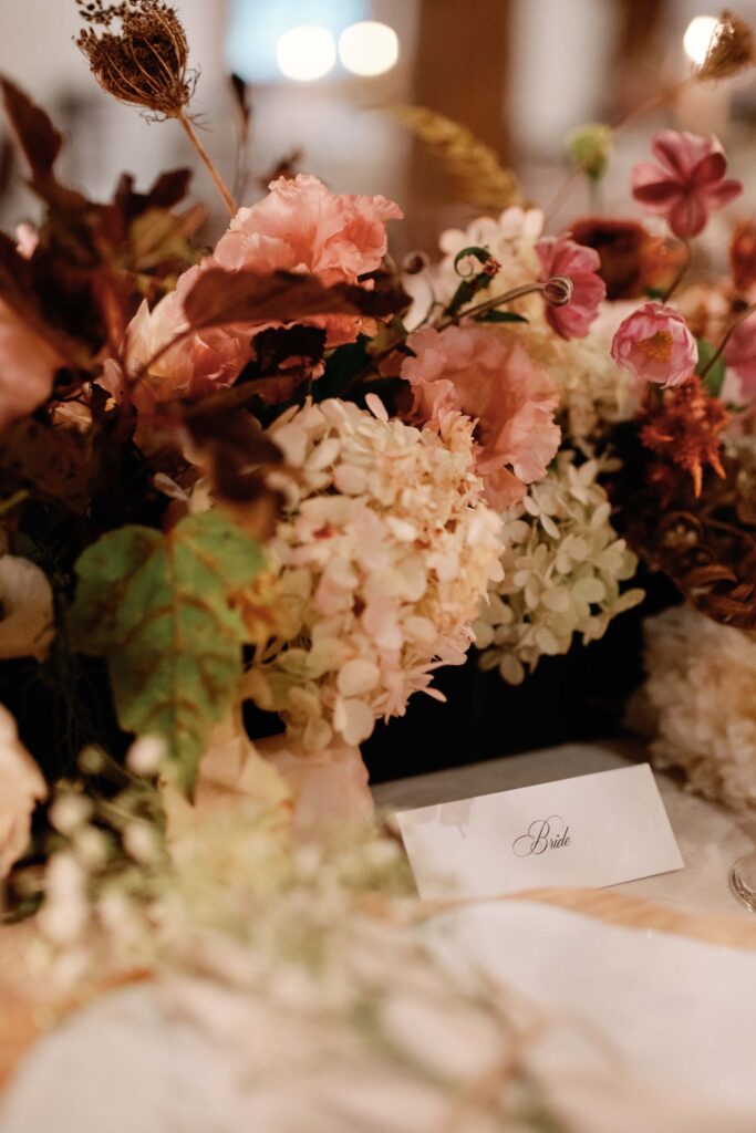 riverside farm vermont wedding in the fall with birds of a flower design reception barn