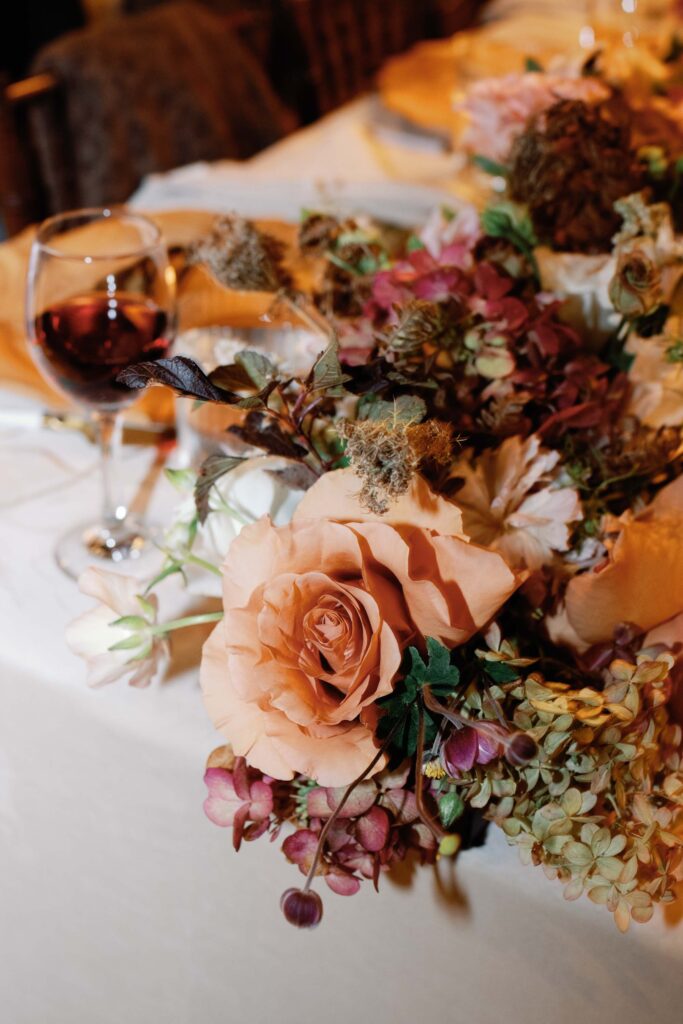 riverside farm vermont wedding in the fall with birds of a flower design reception barn