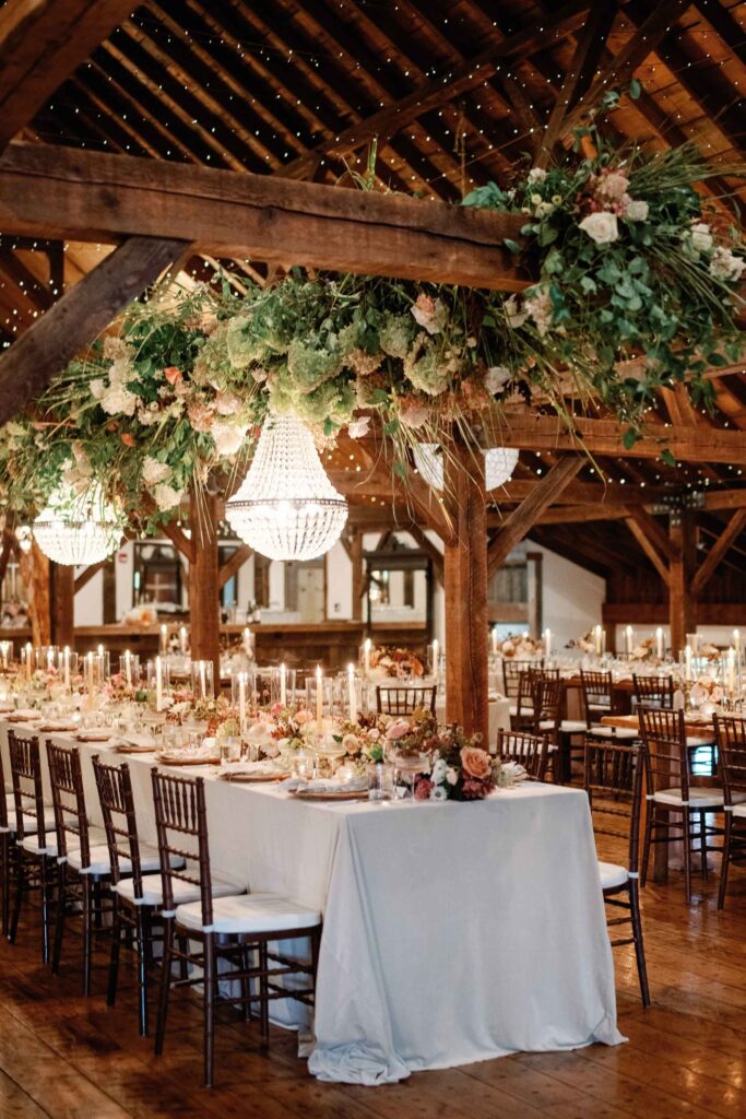 riverside farm vermont wedding in the fall with birds of a flower design reception barn