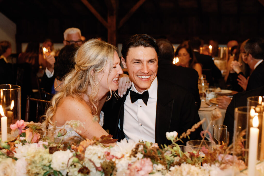 riverside farm vermont wedding in the fall with birds of a flower design reception barn