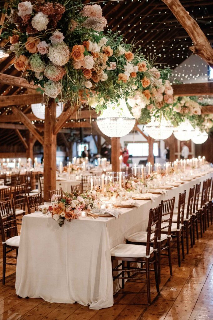riverside farm vermont wedding in the fall with birds of a flower design reception barn