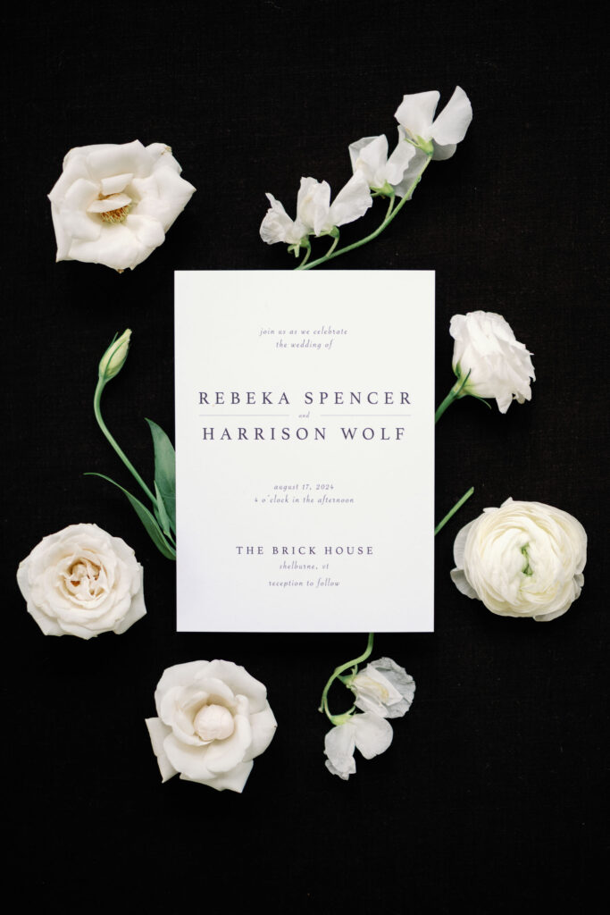 A black-tie Vermont wedding with a Nancy Meyers aesthetic at the historic Shelburne Museum Brick House invitation with black background