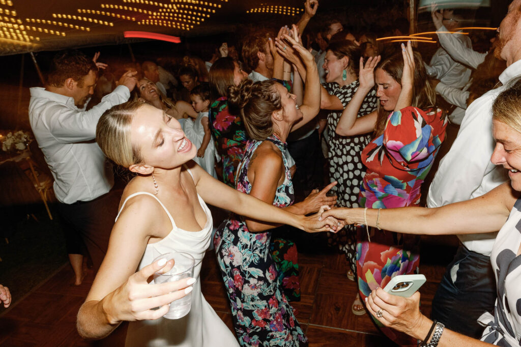 A black-tie Vermont wedding with a Nancy Meyers aesthetic at the historic Shelburne Museum Brick House with Personal notes for every guest, espresso martinis + churros, and sweeping lake views