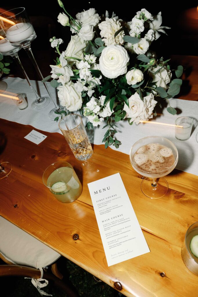 A black-tie Vermont wedding with a Nancy Meyers aesthetic at the historic Shelburne Museum Brick House with Personal notes for every guest, espresso martinis + churros, and sweeping lake views