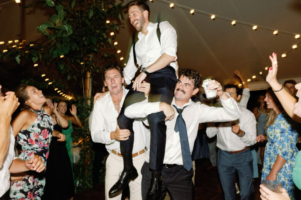 A black-tie Vermont wedding with a Nancy Meyers aesthetic at the historic Shelburne Museum Brick House with Personal notes for every guest, espresso martinis + churros, and sweeping lake views