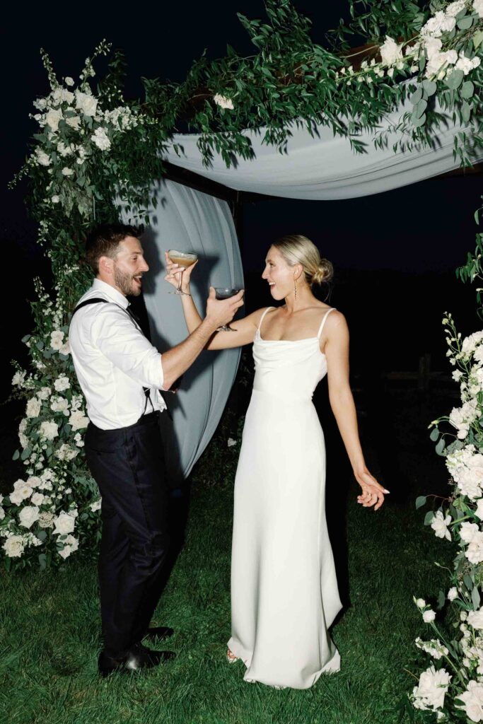A black-tie Vermont wedding with a Nancy Meyers aesthetic at the historic Shelburne Museum Brick House with Personal notes for every guest, espresso martinis + churros, and sweeping lake views