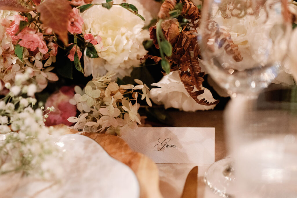 riverside farm vermont wedding in the fall with birds of a flower design reception barn