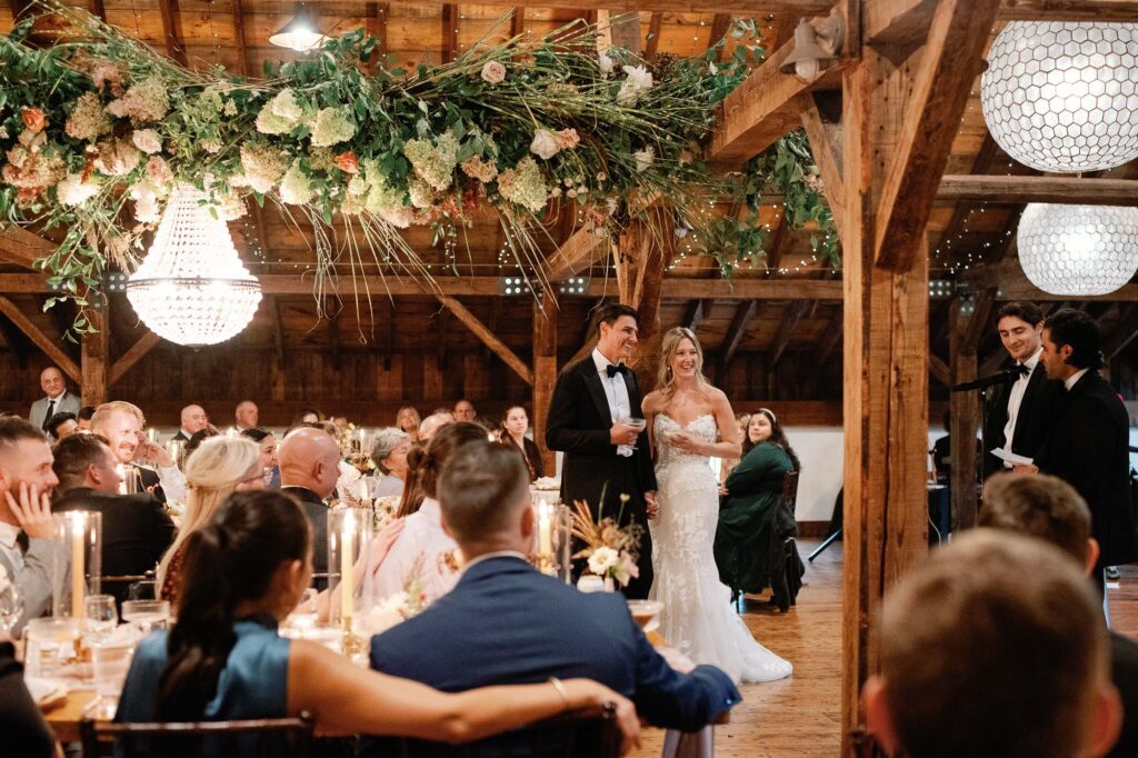 riverside farm vermont wedding in the fall with birds of a flower design reception barn